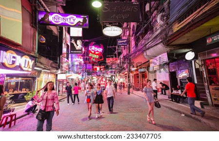 PATTAYA -  NOVEMBER 22: Crowd walking through the Walking Street on November 22, 2014 in Pattaya,Thailand. Its a tourist attraction primarily for night life and entertainment