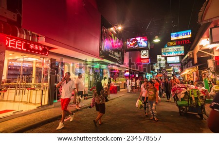 PATTAYA - NOVEMBER 28: Crowd walking through the Walking Street on November 28, 2014 in Pattaya,Thailand. Its a tourist attraction primarily for night life and entertainment