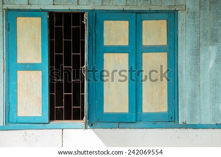 Opening window of old wood house and sun light