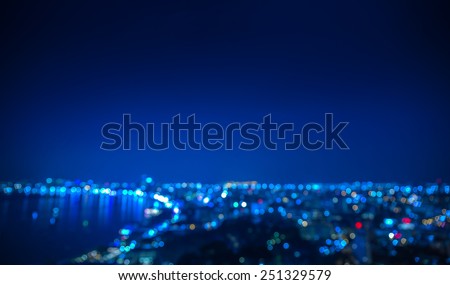 Out of focus coastal city in night time