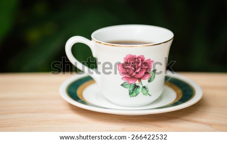 White coffee cup set on wood desk