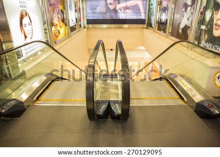 SEOUL,SOUTH KOREA - APRIL 14, 2015 : The escalator inside of Dongwha duty free Department store in Seoul. There are lots of fashion shops i.e. cloths, cosmetic, watch etc.