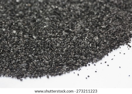 Black carbon powder on white background