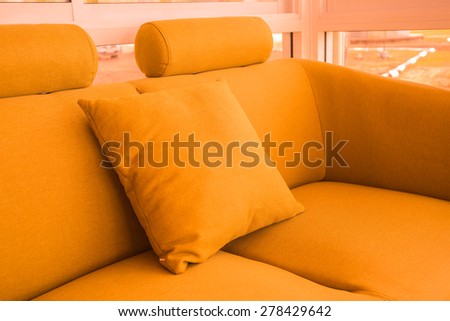 Golden silk pillow on soft seat