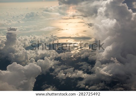 Sky scape cloudscape before sunset.View from window of airplane flying in clouds over Phuket,Thailand