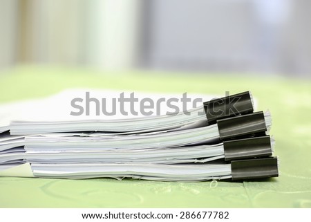 Stack of business report paper files