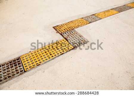 The long iron sieve on cement road