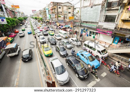 BANGKOK,THAILAND - JUNE 28:Traffic road with motorcycle ,cars, buses, taxis and people at down town of  Bangkok,Thailand on June 28,2015.