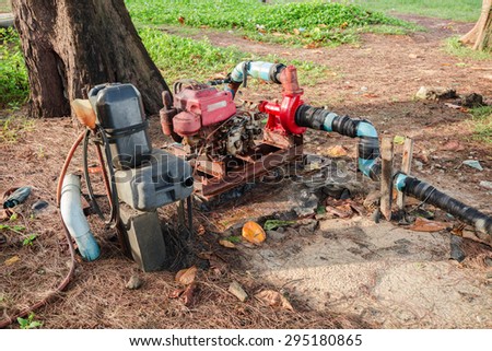 Rusty pump engine in farm