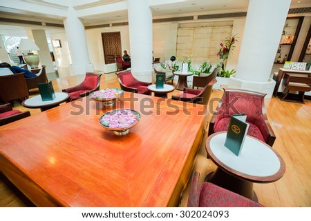 AYUTTHAYA,THAILAND- AUGUST 1 : The living hall and big wooden teak table in Krungsri River hotel in Ayutthaya,Thailand on August 1, 2015.Krungsri River hotel is the biggest and famous in Ayutthaya.