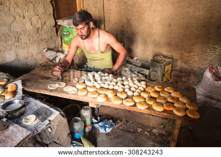 LAMAYURU, INDIA - AUGUST 9 : The young unidentified baker are working in his  bakehouse in village at Lamayuru,India on August 9,2015