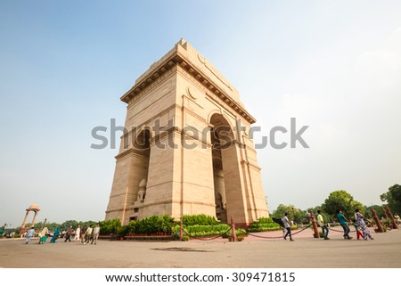NEW DELHI, INDIA - AUGUST 4: The Indian gate and tourists are in New Delhi,India on August 4, 2015. The Indian gate is the national monument of India.