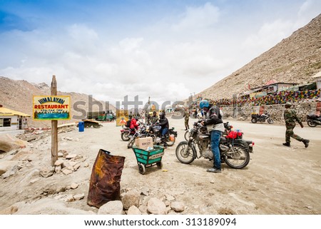 LEH LADAKH , INDIA - AUGUST 11 : The tourists are on Changla Pass point where is a high mountain pass(5,360 m)  in Leh Ladakh,India on August 11, 2015.