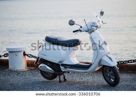 PATTAYA,THAILAND - NOVEMBER 5 : New white Vespa Italian designed scooter is parking on street along the sea at November 5, 2015 in Pattaya,Thailand
