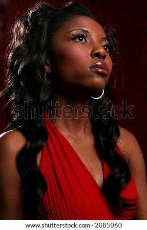 Confident model wearing red evening gown