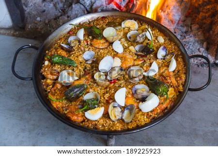 Full Paella cooked on a wood fire at home