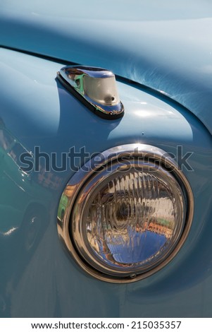 LEON, SPAIN - APRIL 27, 2014: Front and intermittent Lighthouse Seat 600 car light blue. Vehicle manufactured in Spain between 1957 and 1973