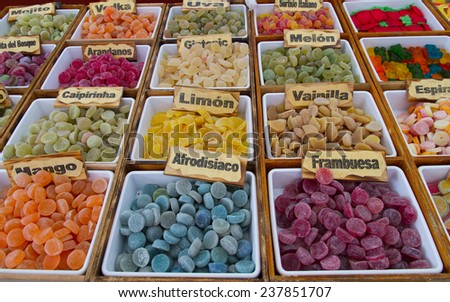 Sales stand at outdoor market sweet jelly bean, artisans in various colors shapes and fruit flavors