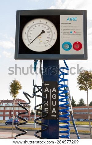 Gas for cars in service. Measuring the air pressure in the wheels (gauge) and water dispenser