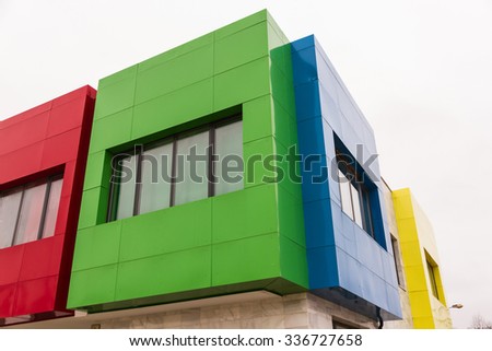 Corner detail of modern building with a facade of colors