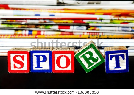 Sport word near many newspapers