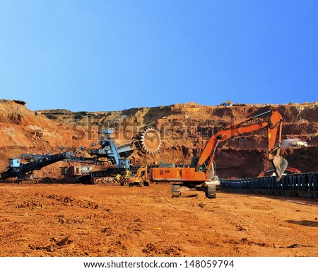 Multiton machinery and Excavators in the open pit mine northern Thailand