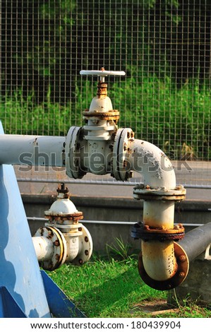 water pipeline - rusty dirty steel pipe valves equipment connection metal