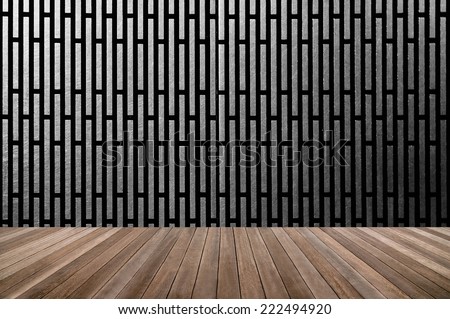 wood textured in a room interior on black shiny metal  background