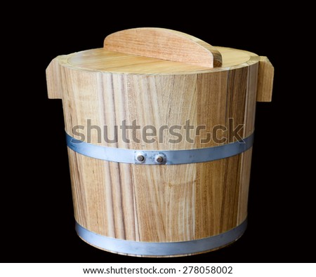 wooden bucket on black background