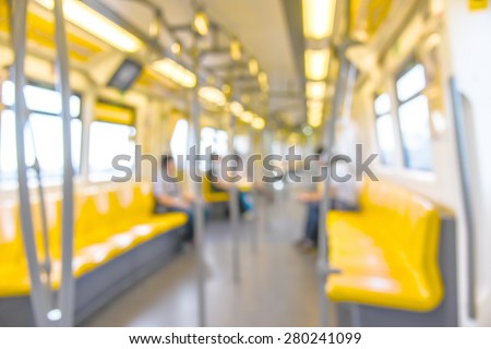 abstract blurred photo of interior train with seat and people background