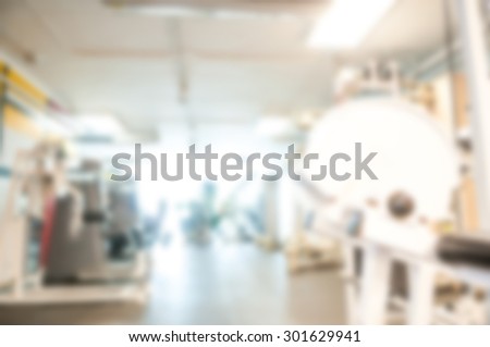 blurred image of gym for background - healthy fitness club clean center