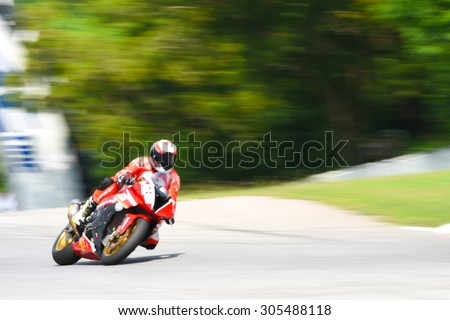 motorcycle racing -  winning leadership competing effort - blurred background motion blur