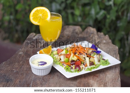Assorted fresh fruits flying in a dish