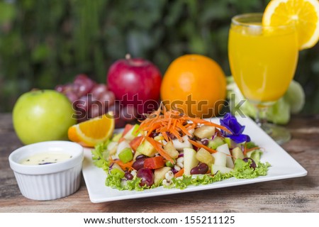Assorted fresh fruits flying in a dish