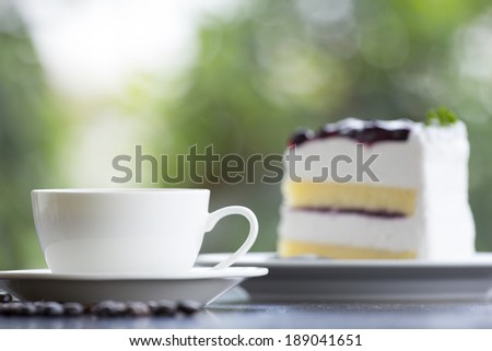 Coffee and bread on wooden table