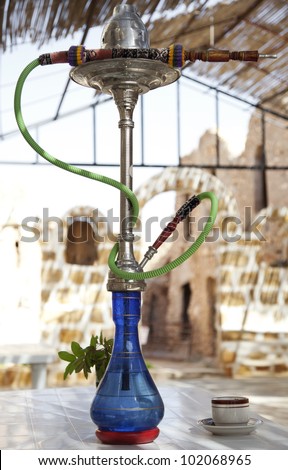 The arabic style of smoking water pipe on the table.