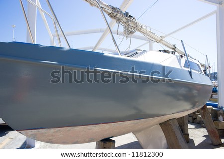 The sailboat out of water for maintenance.