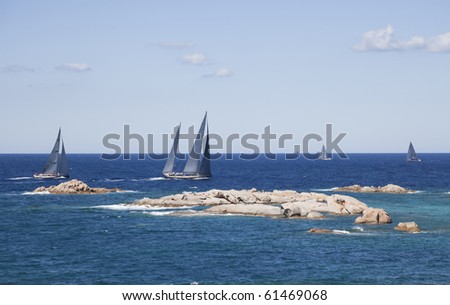 The sailboat racing around the island in Sardinia.
