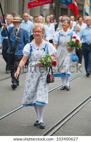 ZURICH - AUGUST 1: Swiss National Day parade on August 1, 2009 in Zurich, Switzerland. Woman in a historical costume.