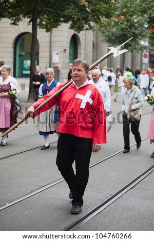 ZURICH - AUGUST 1: Swiss National Day parade on August 1, 2009 in Zurich, Switzerland. Representative of canton Schwyz in a historical costume.