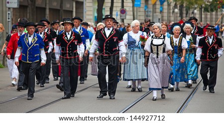 ZURICH - AUGUST 1: Swiss National Day parade on August 1, 2011 in Zurich, Switzerland. Representative of canton Appenzeller in a historical costume.