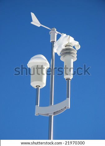 Automatic weather station against blue sky