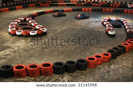 Safety barriers made of old wheels in indoor carting hall