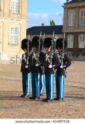 COPENHAGEN, DENMARK - AUGUST 25: unidentified soldiers of the Royal Guard in Amalienborg Castle by changing the guards on August 25, 2010 in Copenhagen, Denmark