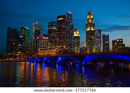 SINGAPORE - FEBRUARY 22: Singapore skyline at sunrise on February 22, 2013 in Singapore. Singapore business district skyline is one of the famous tourist attractions of the city.