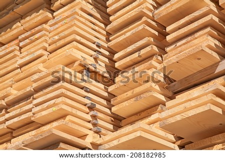 Stack of new wooden studs at the lumber yard