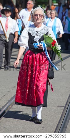 ZURICH - AUGUST 1: Swiss National Day parade on August 1, 2012 in Zurich, Switzerland. Woman in a historical costume.