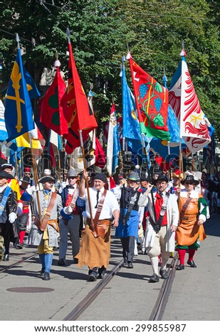 ZURICH - AUGUST 1: Swiss National Day parade on August 1, 2012 in Zurich, Switzerland. Representatives of  professional guilds in a historical costumes.