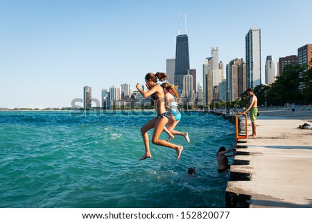 CHICAGO, IL - JULY 11: unidentified teenagers jump in Lake Michigan on July 11, 2012 in Chicago, IL