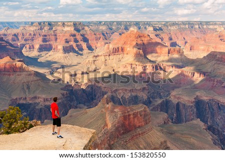 GRAND CANYON, ARIZONA, SEPT 25: Unidentified person look at the Grand Canyon on Sept 25, 2012 in Arizona. The Grand Canyon is a steep-sided canyon carved by the Colorado River in the state of Arizona.
